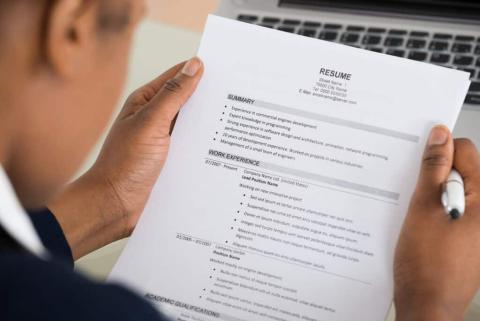 man looking at resume